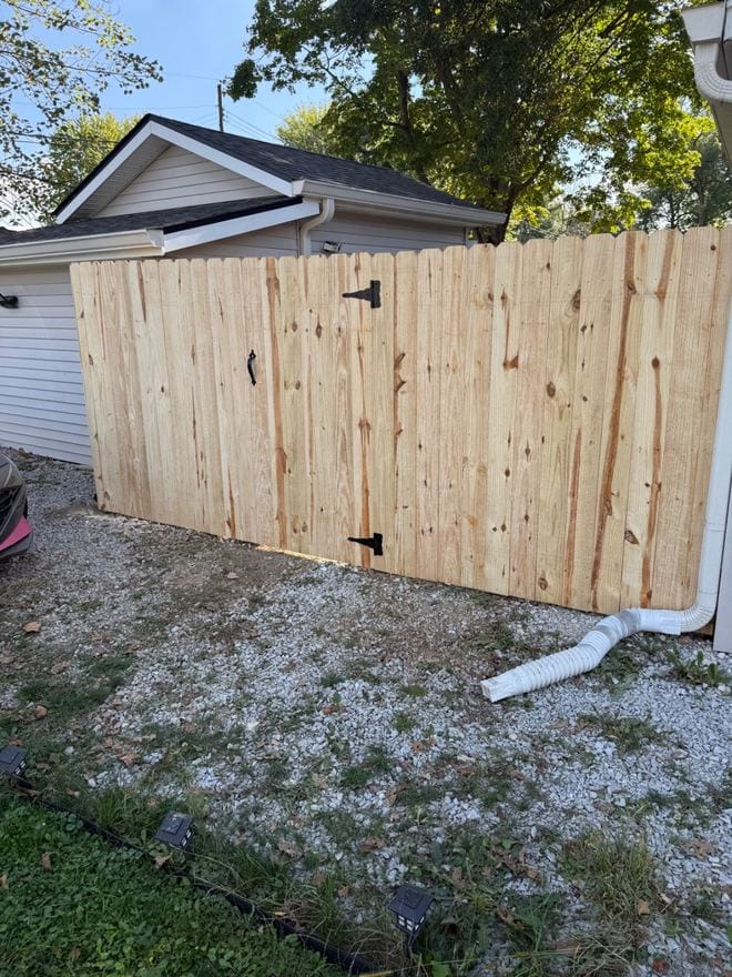 Treated wood privacy fence