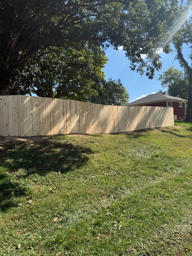 Treated wood privacy fence