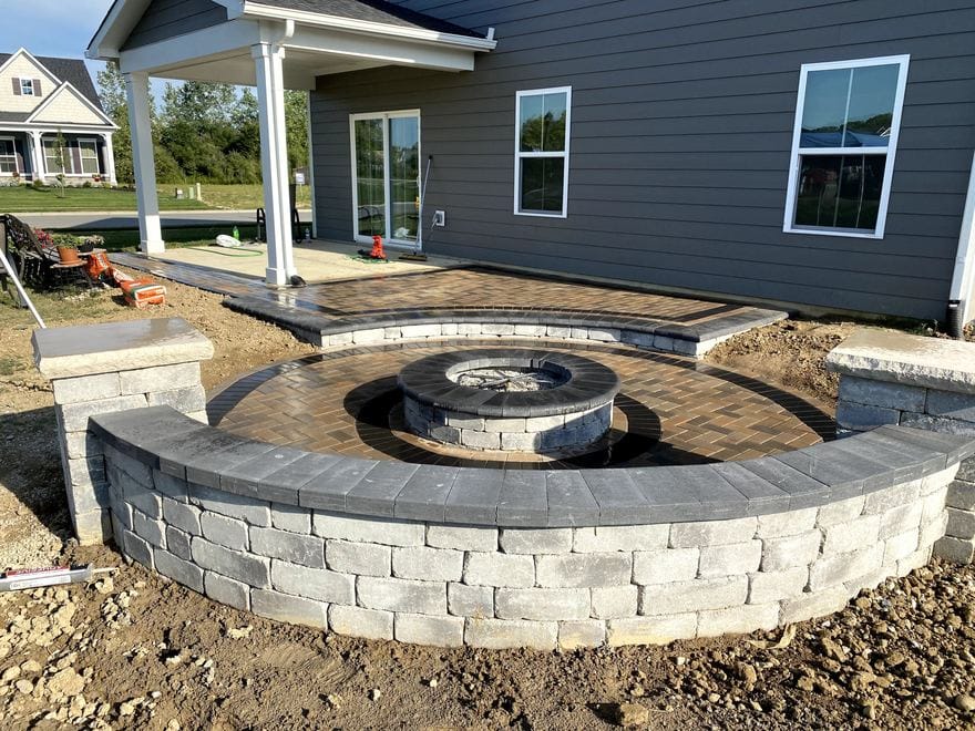 Paver patio with a stone fire pit