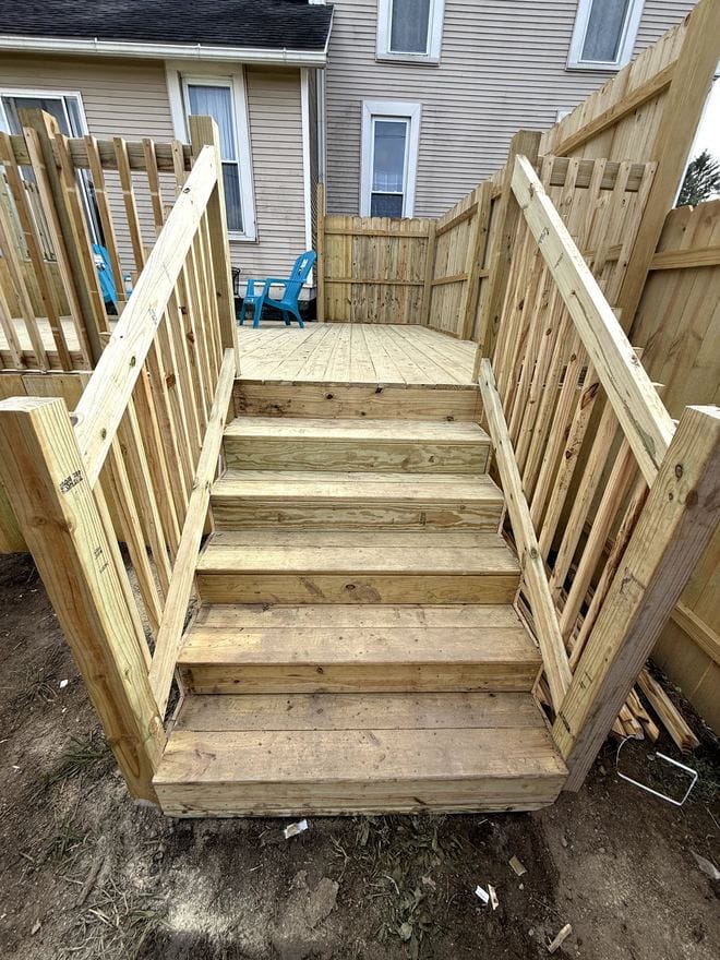New wood deck stairs with railing